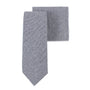 An elegant necktie and pocket square set featuring a navy blue herringbone pattern, known as the Navy Blue Herringbone Skinny Cotton Tie & Pocket Square Set.