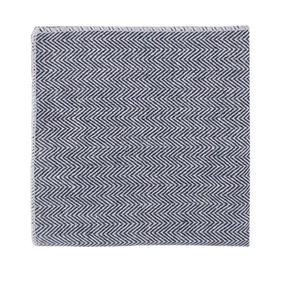 A navy blue herringbone patterned pocket square, neatly folded with sophistication.
