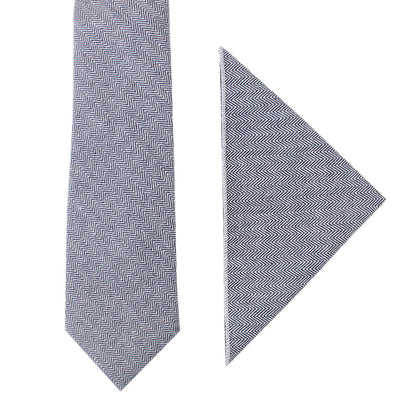 The Navy Herringbone Cotton Business Tie & Pocket Square Set is elegantly displayed on a crisp white background.