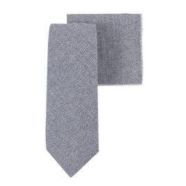 The Navy Herringbone Cotton Business Tie & Pocket Square Set features a sleek blue and white zigzag pattern on a navy tie, ideal as a business accessory.