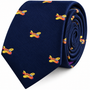 Orange Aircraft Skinny Tie in navy blue rolled into a coil, featuring a repeating pattern of small orange and yellow airplane illustrations.