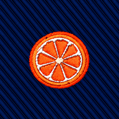 Orange Skinny Tie featuring an embroidered orange slice patch on a dark blue ribbed background.