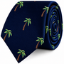 Palm Tree Skinny Tie in dark blue, shown rolled as a tropical accessory with an embroidered palm tree pattern.