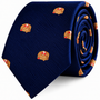 A navy blue Pancakes Skinny Tie featuring a repeating pattern of pancake stacks topped with strawberries.