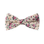 The Pastel Pink Rose Floral Cotton Bow Tie & Pocket Square Set boasts vibrant orange blooms on a cream background, making it an ideal wedding accessory for an elegant ensemble.