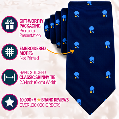 A navy blue Pickle Ball Skinny Tie featuring a repeating pattern of paddles and yellow balls, alongside icons and text detailing product features including packaging, embroidered motifs, and sizing.