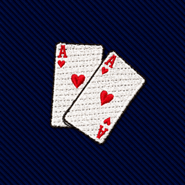 Embroidered patch of two overlapping ace of hearts playing cards on a dark blue ribbed Poker Cards Skinny Tie.