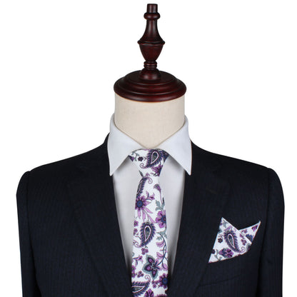 A mannequin displays a black pinstripe suit and white dress shirt, paired with the Purple Floral White Paisley Skinny Tie—an elegant men’s formalwear accessory that’s also perfect as a wedding tie.