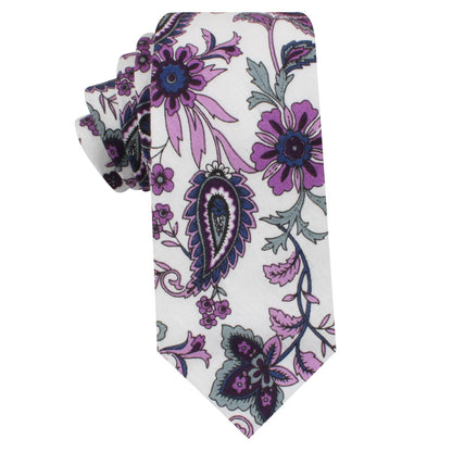 The Purple Floral White Paisley Skinny Tie showcases purple, blue, and gray patterns—an ideal choice for men's formalwear or as a stylish wedding tie.