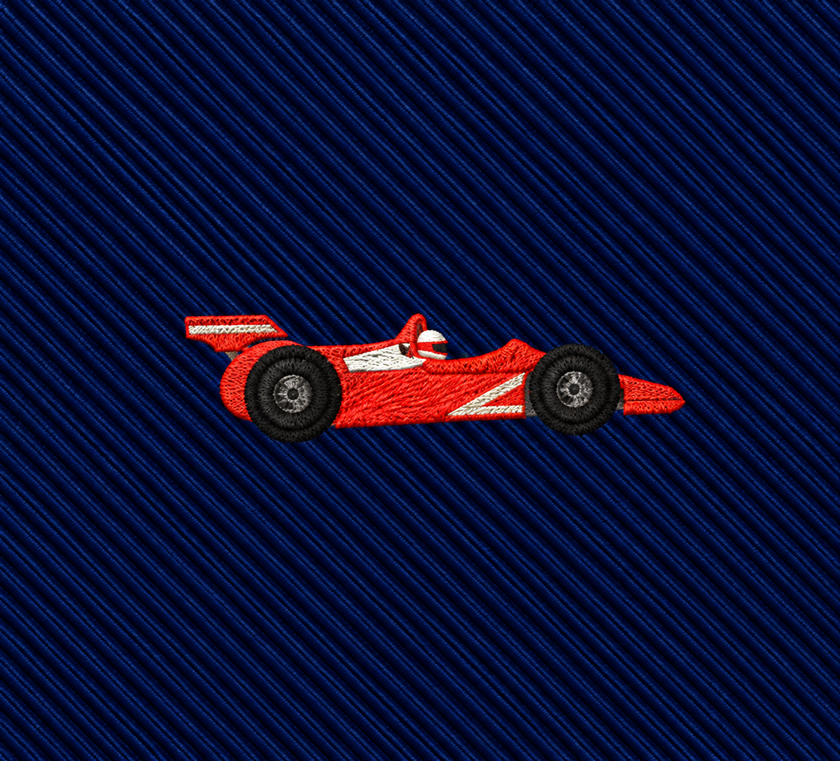 Featuring a red race car embroidery on dark blue, diagonally striped fabric, the Racing Car Skinny Tie is the perfect motorsports accessory.