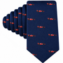Introducing the Racing Car Skinny Tie in navy blue, showcasing a repeating pattern of small red race cars arranged evenly across the fabric—a stylish motorsports accessory perfect for enthusiasts.
