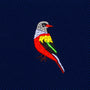 Red Parrot Skinny Tie featuring an embroidered parrot in red, yellow, green, and white on dark blue ribbed fabric.