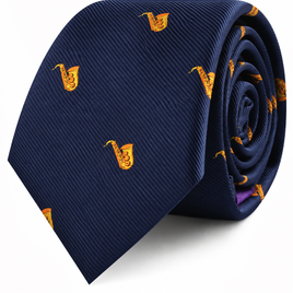A Saxophone Skinny Tie in navy blue, featuring a pattern of small, embroidered yellow saxophones and rolled up on a white background—an ideal gift for any saxophone enthusiast.