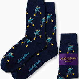 The Scuba Diver Socks are navy blue and adorned with a scuba charm, showcasing a pattern of scuba divers holding yellow fins. The side is elegantly detailed with the text "AusCufflinks Australia," enhancing their stylish appearance.