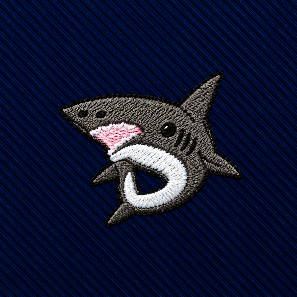 A Great White Shark Skinny Tie featuring an embroidered shark patch on a navy blue diagonal striped background.