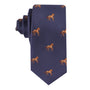 The Stallion Horse Skinny Tie is a navy blue necktie adorned with a repeating pattern of small embroidered brown horses.