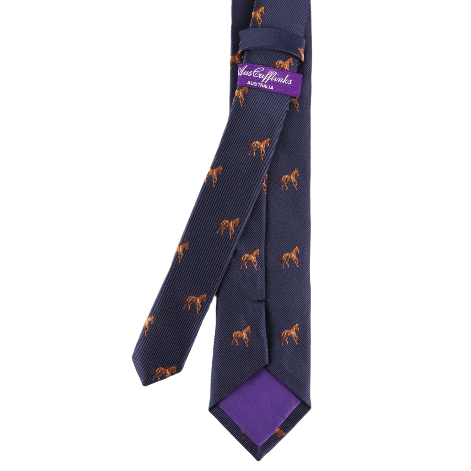 The Stallion Horse Skinny Tie features a navy blue base with small brown horse patterns, complemented by a visible purple label and inner lining.