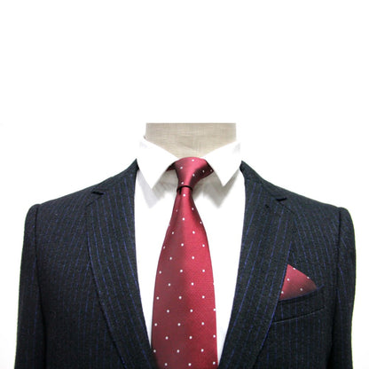 A mannequin in a dark pinstripe suit showcases the sophistication of the Red White Polka Dot Business Tie & Pocket Square Set against a plain white background.
