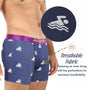 Model wears Swimming Underwear in navy with a swimmer pattern and purple waistband. Inset highlights tiny fabric perforations. Breathable, moisture-wicking material and inner lining ensure all-day comfort.