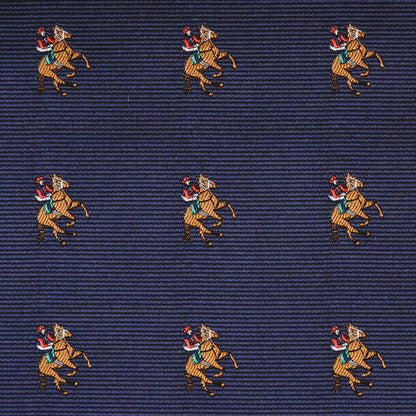 Close-up of dark blue fabric with a repeated pattern of two polo players on horses—ideal for the Thoroughbred Racing Horse Pocket Square or any horse-themed collection.