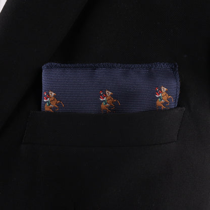 A Thoroughbred Racing Horse Pocket Square in navy blue, featuring embroidered horse and rider designs, accents the pocket of a black blazer.