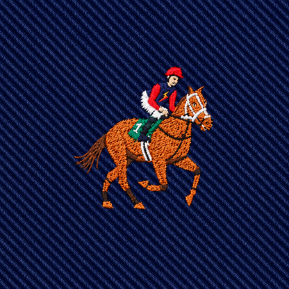 Embroidered with a vivid image of a jockey in red atop a brown horse sporting a green saddle, this elegant design is stitched on dark blue textured fabric—making the Thoroughbred Racing Horse Skinny Tie an ideal addition to any equestrian or horse racing tie collection.