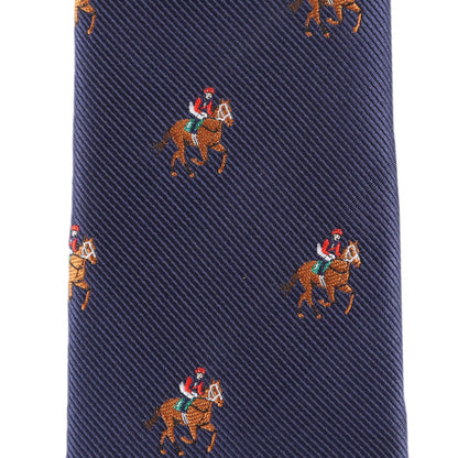 Close-up of the Thoroughbred Racing Horse Skinny Tie in navy blue, featuring a pattern of evenly spaced embroidered jockeys on horses.