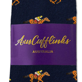 Melbourne Race Horse Socks: Navy blue equestrian socks featuring a jockey-and-horse pattern, packaged with a purple AusCufflinks Australia label—an ideal unique gift for racing fans.