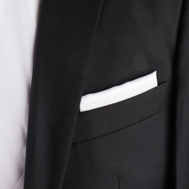 Close-up of a black suit jacket radiating elegance, featuring a White Silk Handkerchief neatly placed in the breast pocket.