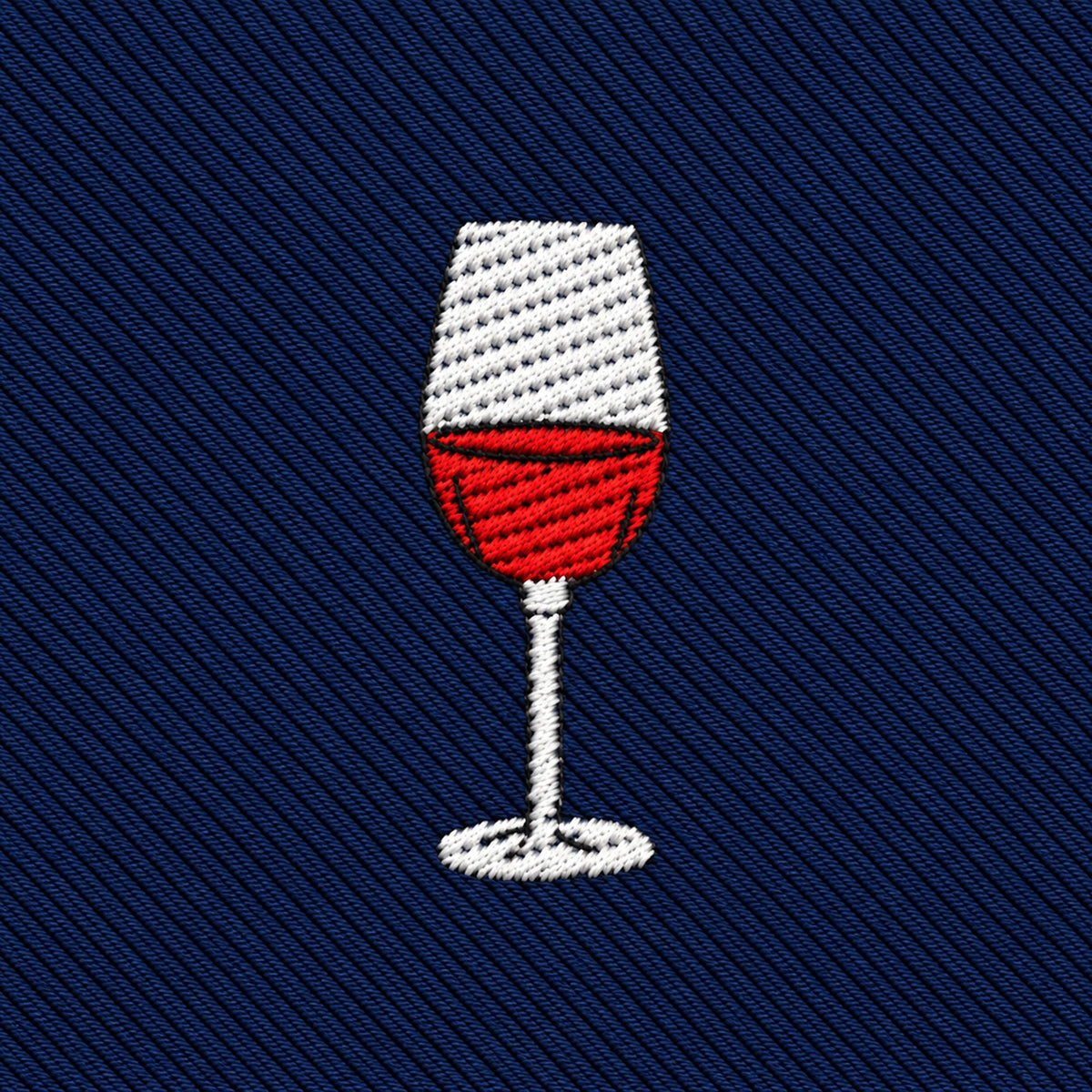 Wine Skinny Tie in navy blue with a diagonal-ribbed texture, featuring an embroidered icon of a wine glass filled with red liquid.