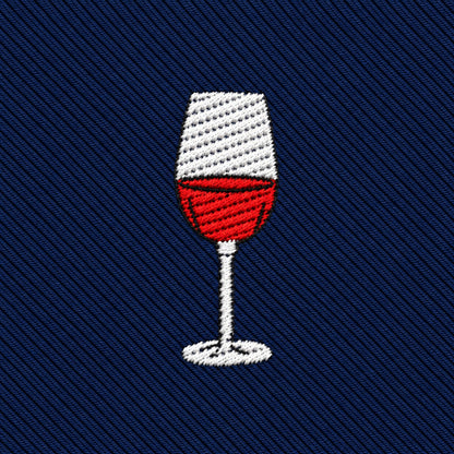 Wine Skinny Tie in navy blue with a diagonal-ribbed texture, featuring an embroidered icon of a wine glass filled with red liquid.