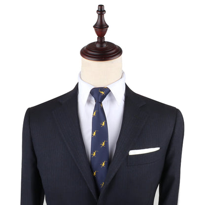 A tailored dark suit with a white shirt, complemented by a Ski Tie and a pristine white pocket square, displayed on a mannequin.