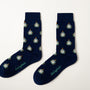 Fun novelty astronaut socks for men featuring white space helmet design on navy background