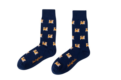 Fun novelty socks for men featuring cute corgi dog design on navy background