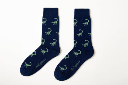 Fun novelty Brontosaurus socks for men featuring green dinosaur design on navy background