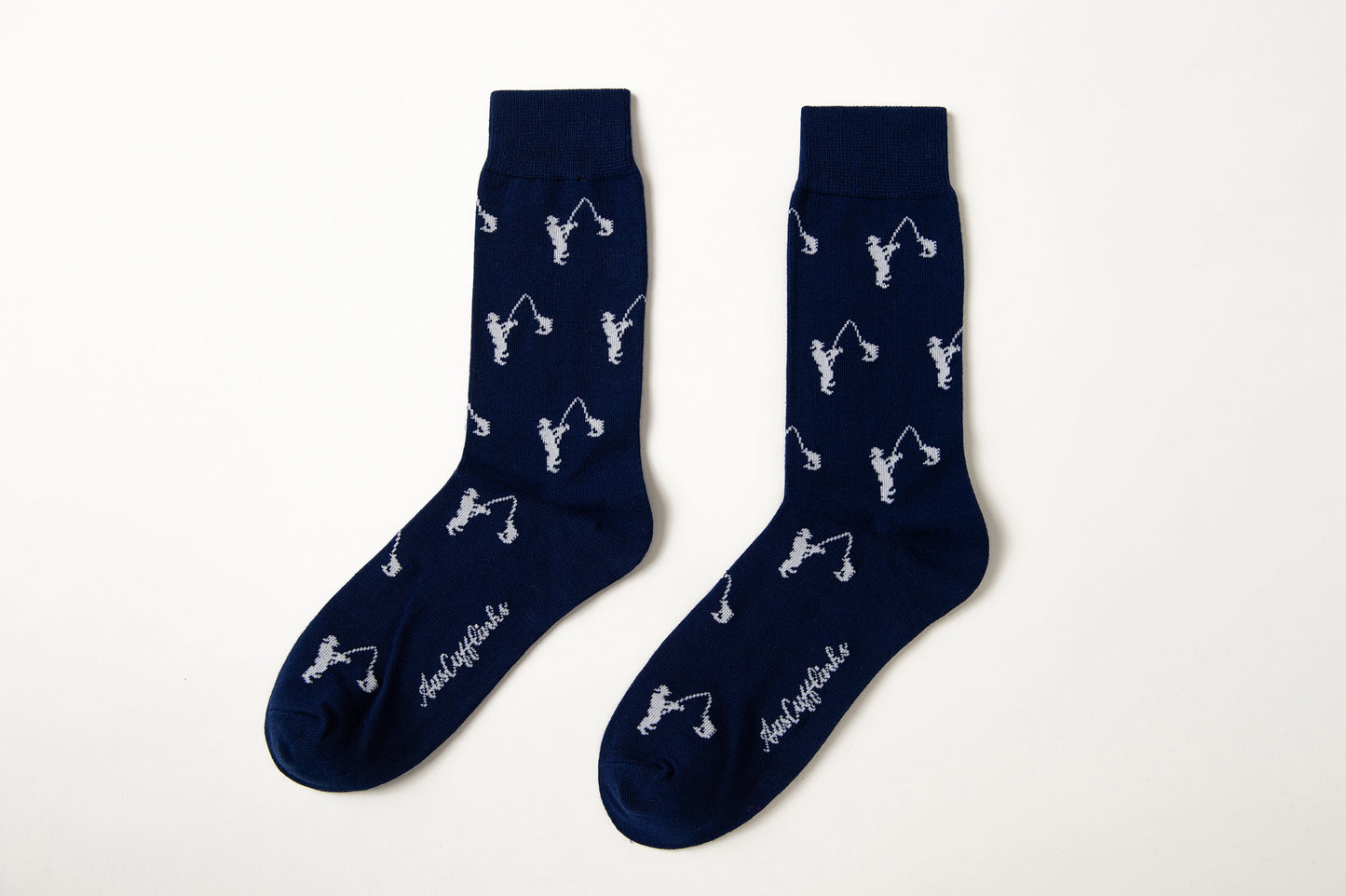 Fun novelty fishing-themed socks for men featuring white fisherman design on navy background