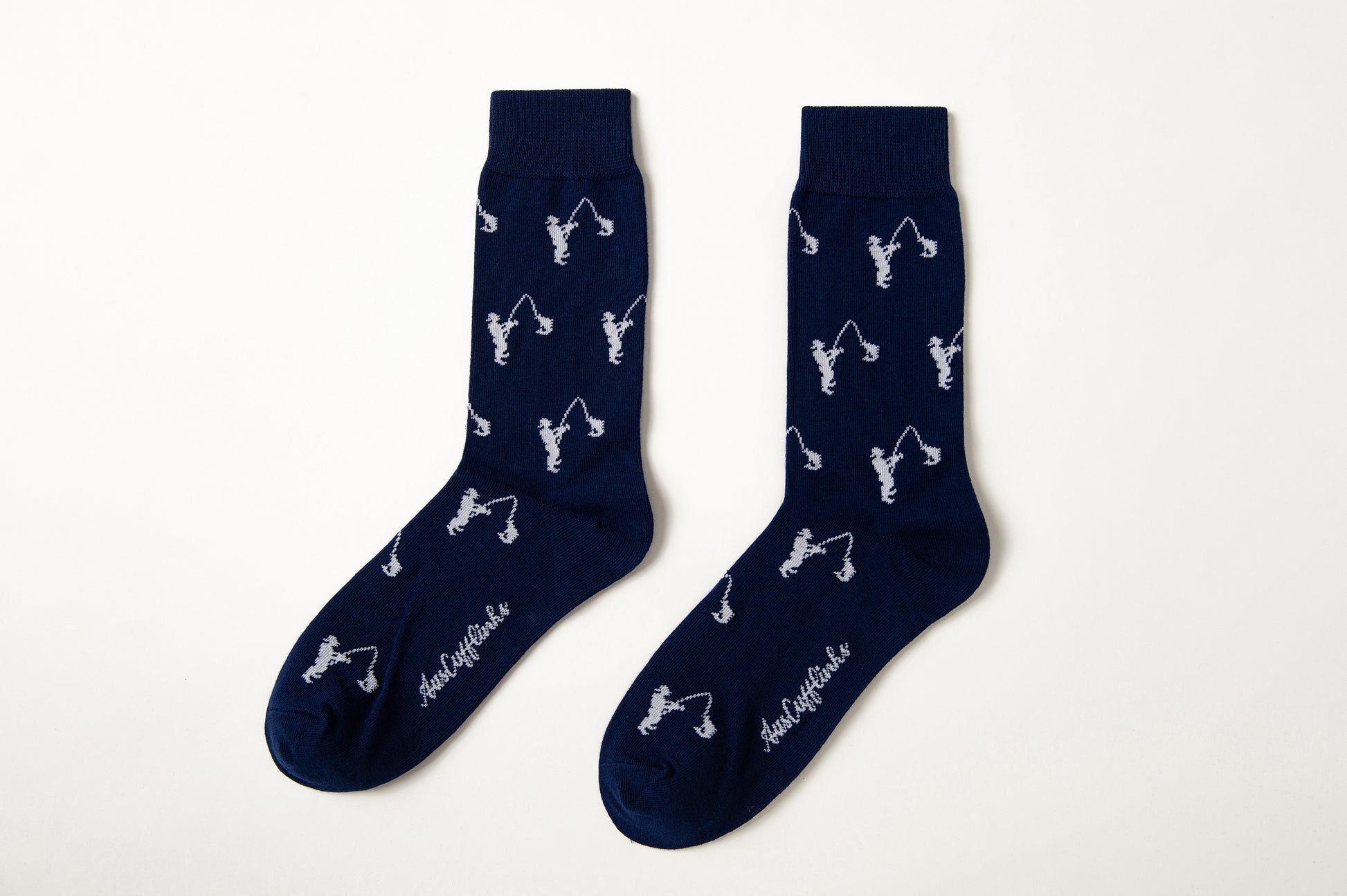 Fun novelty fishing-themed socks for men featuring white fisherman design on navy background