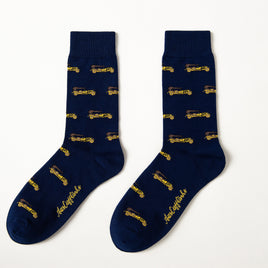 Fun novelty socks for men featuring gold vintage car design on navy background