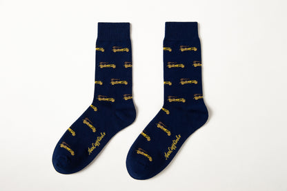 Fun novelty socks for men featuring gold vintage car design on navy background