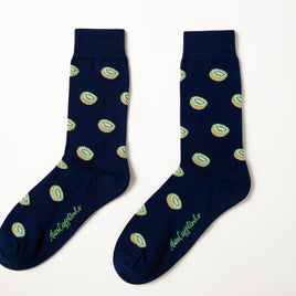 Kiwi Socks: Navy blue tropical socks featuring a repeating green kiwi fruit pattern and cursive text near the toes, shown on a white background.