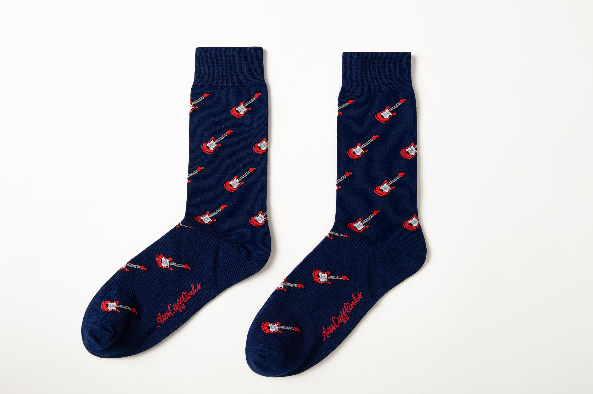 Fun novelty music socks for men featuring red electric guitar design on navy background