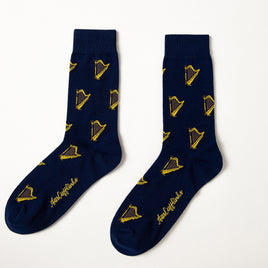 Harp Socks in navy blue with a yellow and black harp pattern and gold cursive text near the toes, shown on a white background—perfect for classical music lovers.