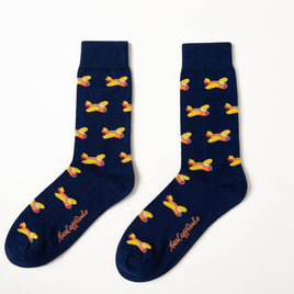 Fun novelty socks for men featuring orange airplane design on navy background