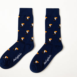 Fun novelty tropical bird socks for men featuring vibrant toucan design on navy background