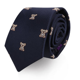 A rolled-up Koala Skinny Tie with an embroidered pattern of small, light brown teddy bears that adds a touch of cuddly charm.