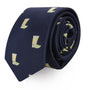 The Tequila Skinny Tie is a rolled navy-blue accessory with a dapper design, featuring a pattern of small yellow drinks with green garnishes, adding zest to your look.