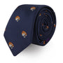 A rolled Tiger Skinny Tie in navy blue featuring small embroidered tiger heads, highlighting bold fashion in every detail.