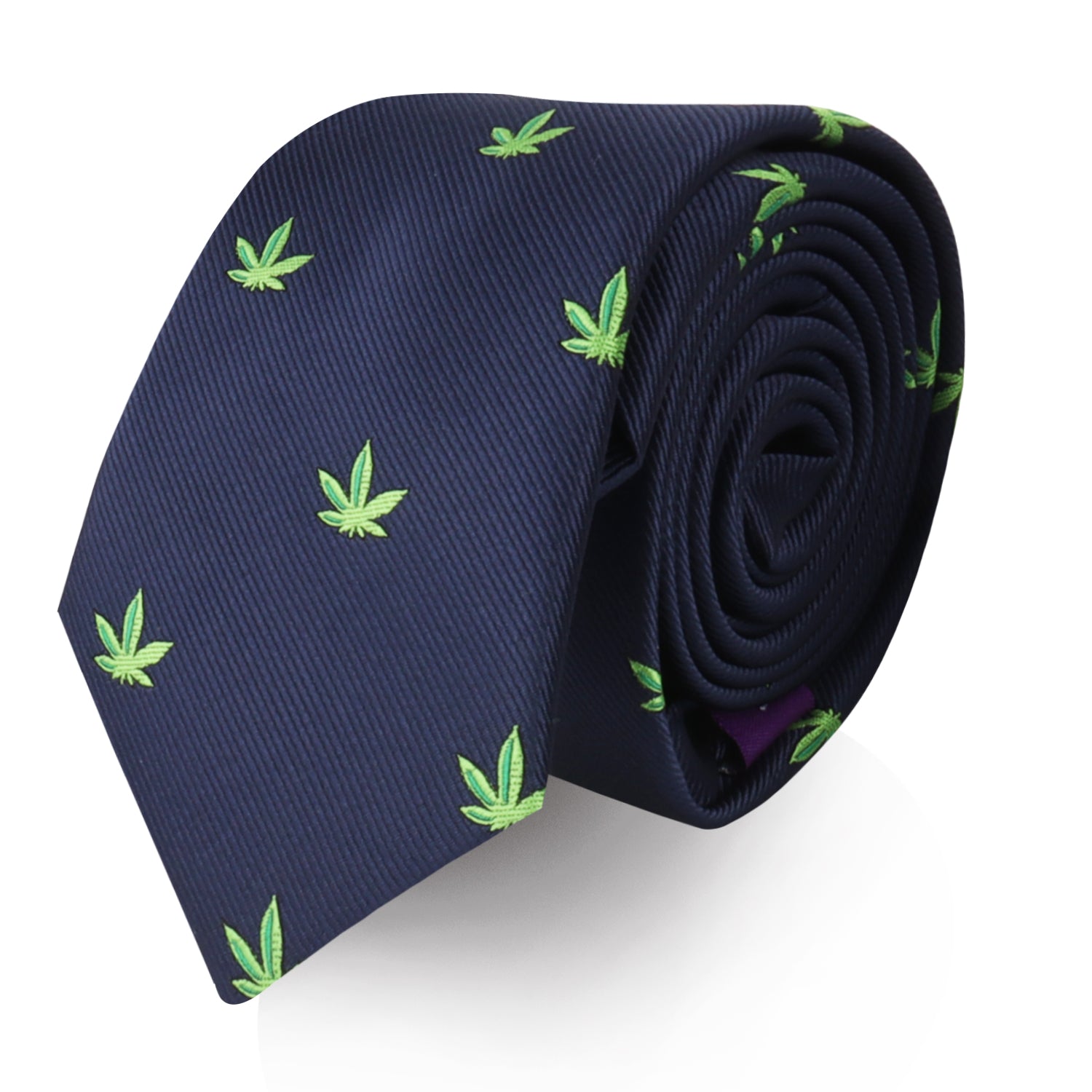 A product called the Weed Skinny Tie is a navy blue accessory designed with a bold statement pattern featuring small green marijuana leaf motifs.