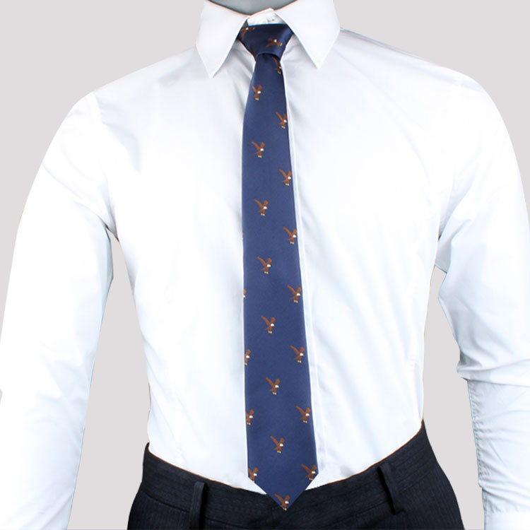 A mannequin wearing a blue Eagle Skinny Tie with an eagle motif.