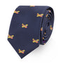 The Orange Aircraft Skinny Tie showcases impeccable style with its vibrant hues and small, colorful rocket ship patterns on a navy blue background.